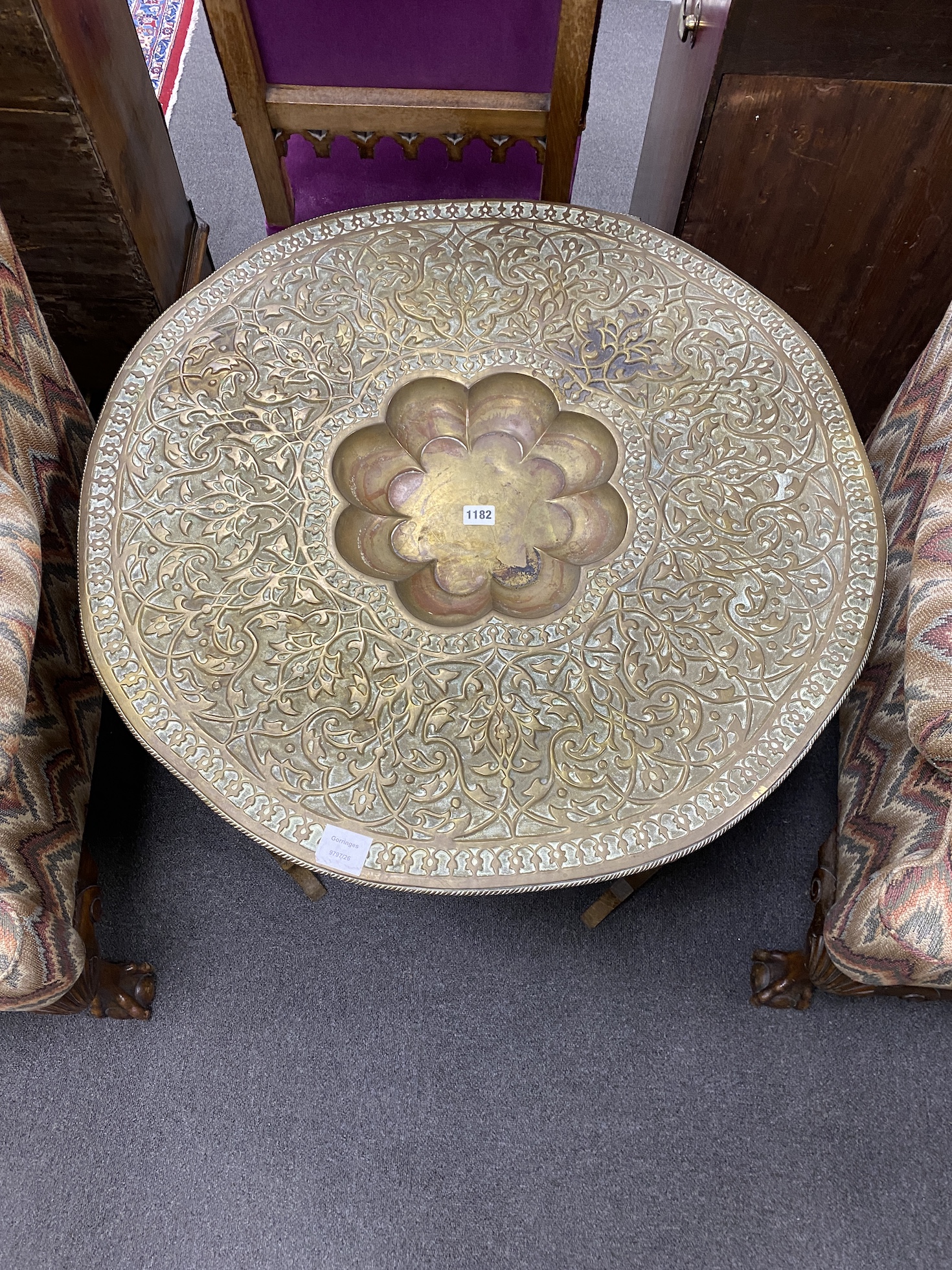 An Indian circular brass tray top table, diameter 76cm, height 59cm